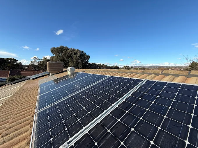 Limitless Roof Solutions wide roof project with solar panels